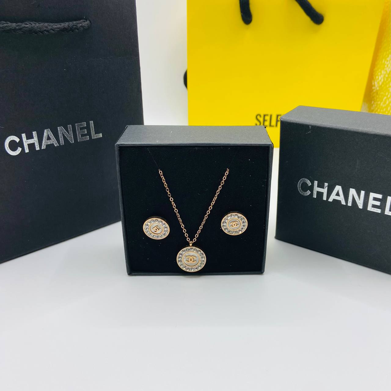 Chanl earings and necklace set with packaging to1809