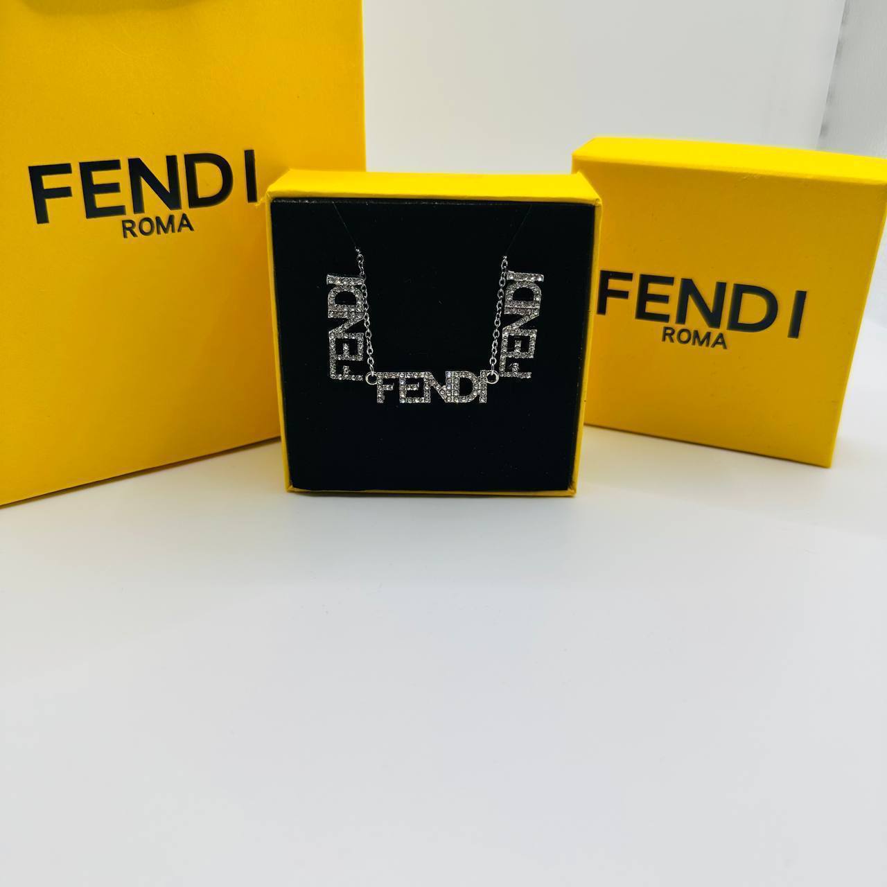 fend earings and necklace set with packaging to1704