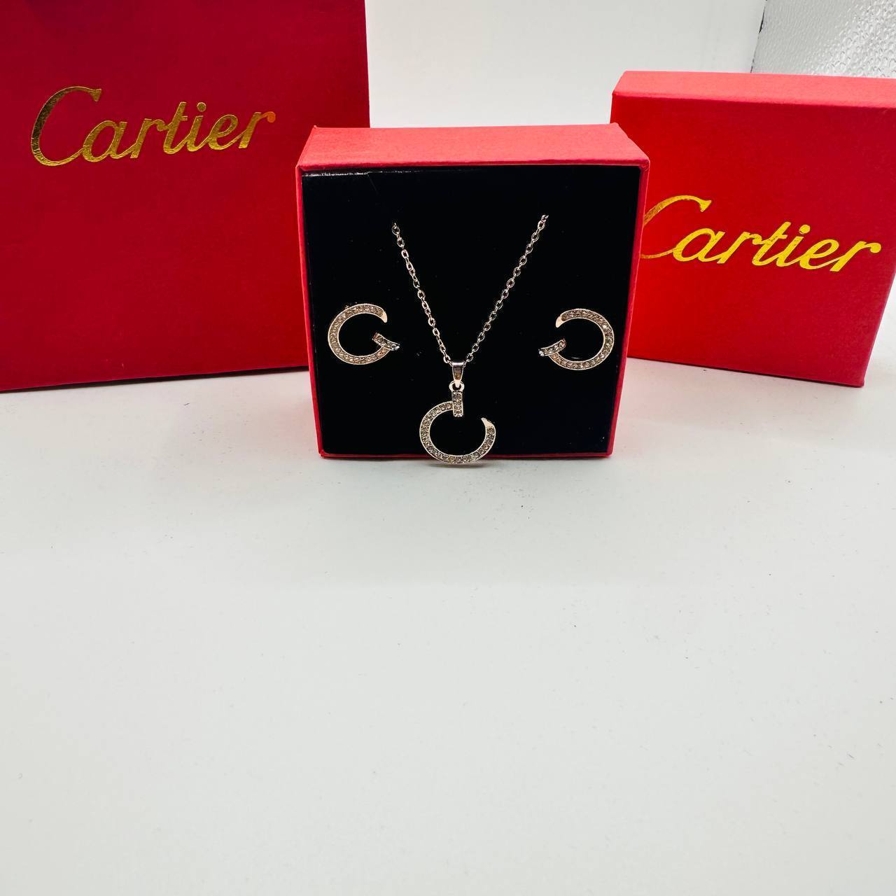 Cartie earings and necklace set with packaging to2904
