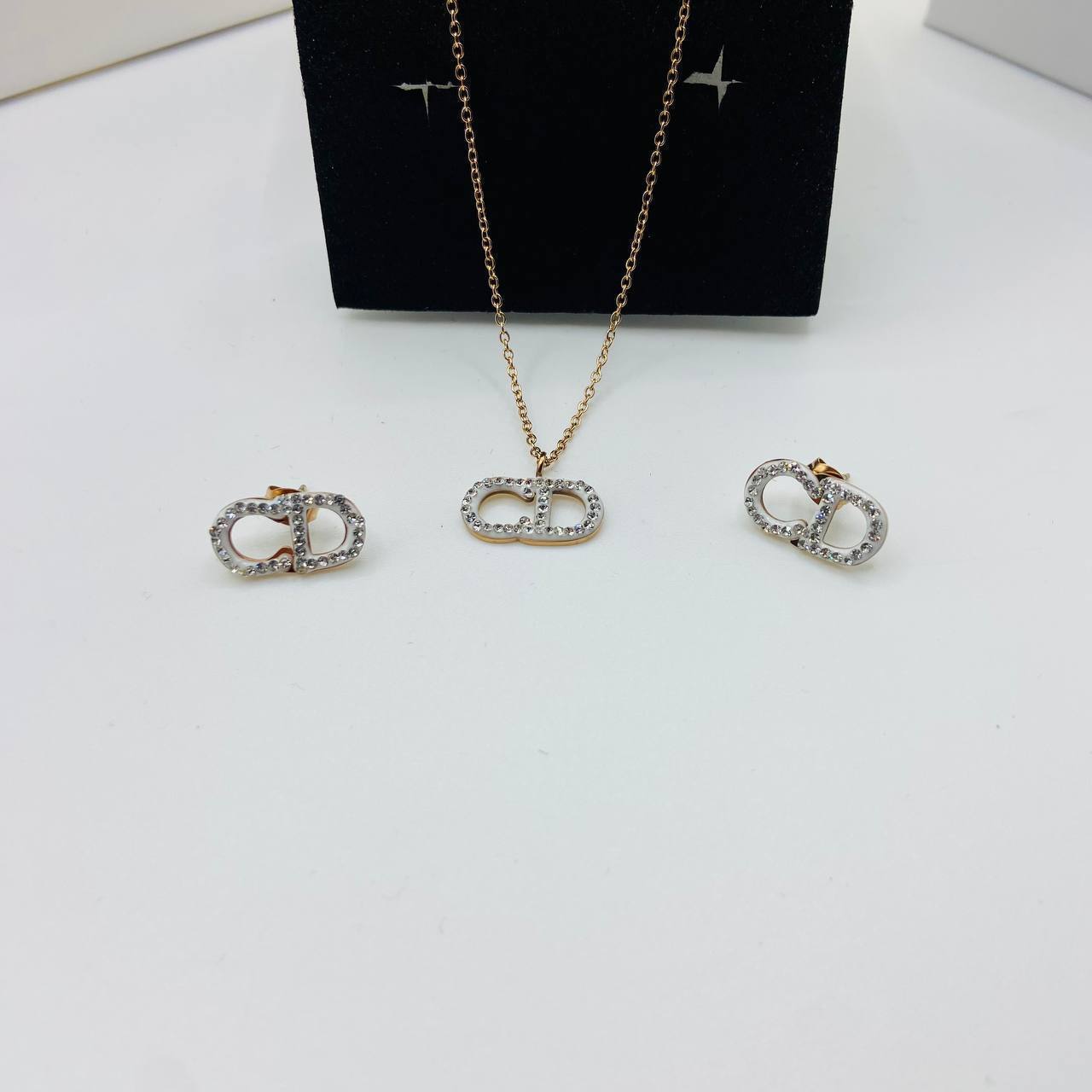 CD DIO earings and necklace set with packaging to0105