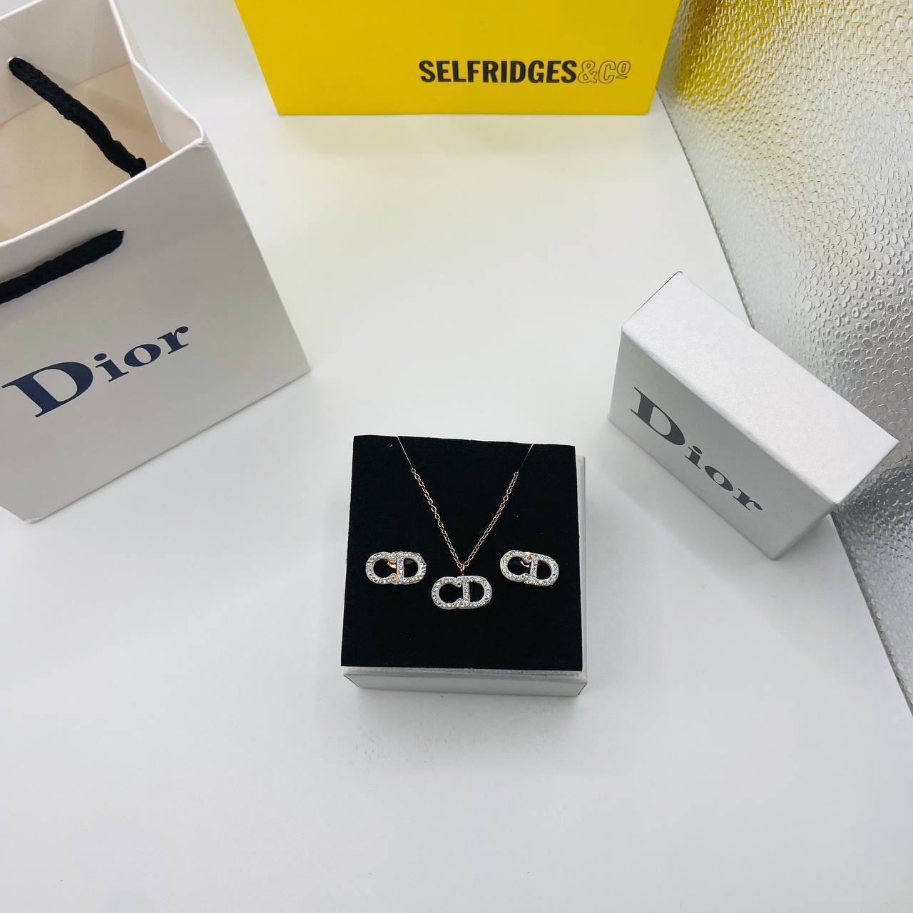 CD DIO earings and necklace set with packaging to0105
