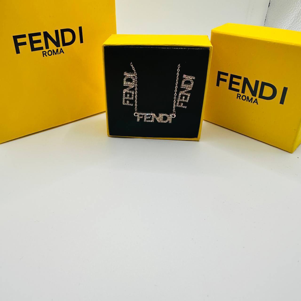 Fend earings and necklace set with packaging to1212