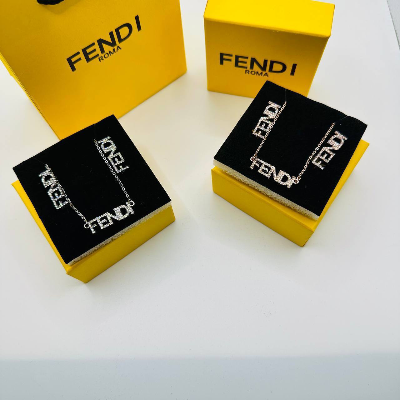 Fend earings and necklace set with packaging to1212