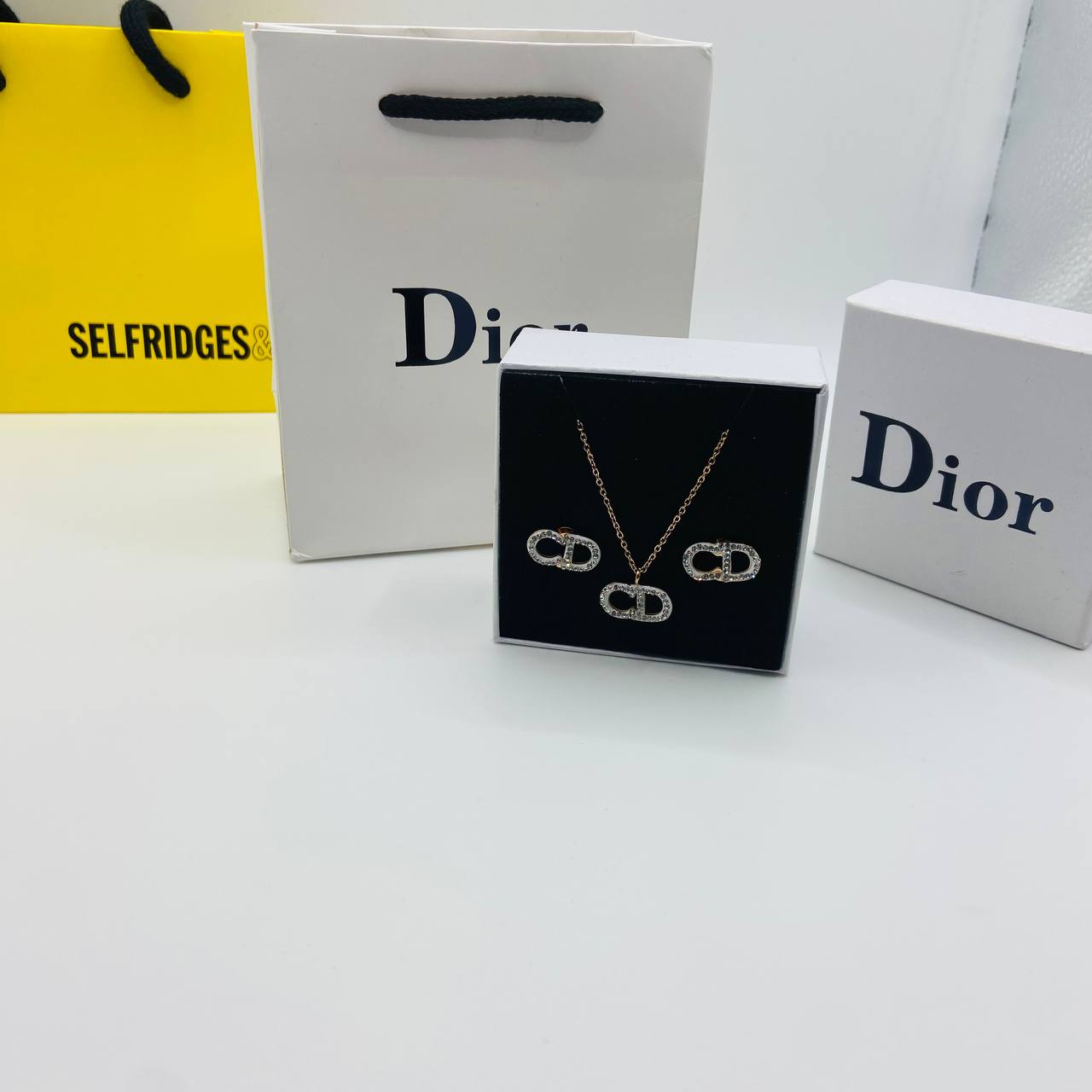 CD. DOR earings and necklace set with packaging to1009