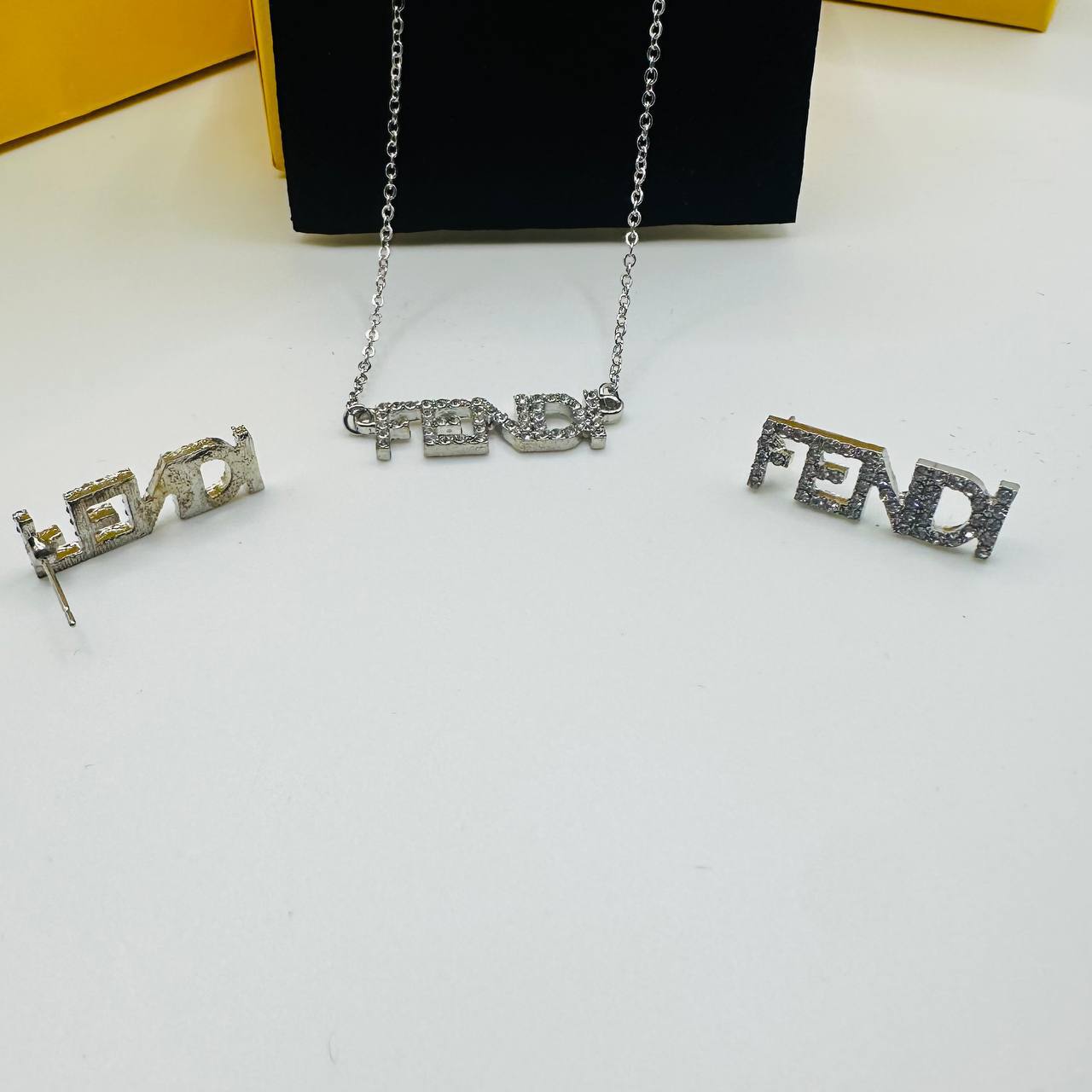 fend earings and necklace set with packaging to2909