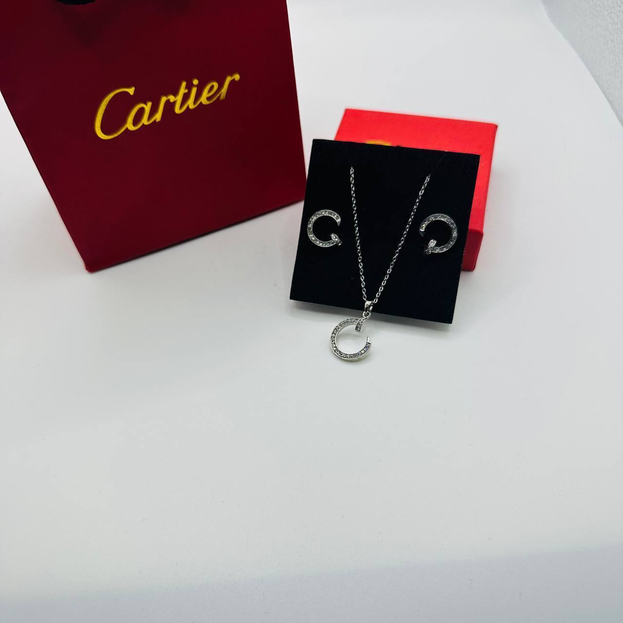 Cartie earings and necklace set with packaging to2904