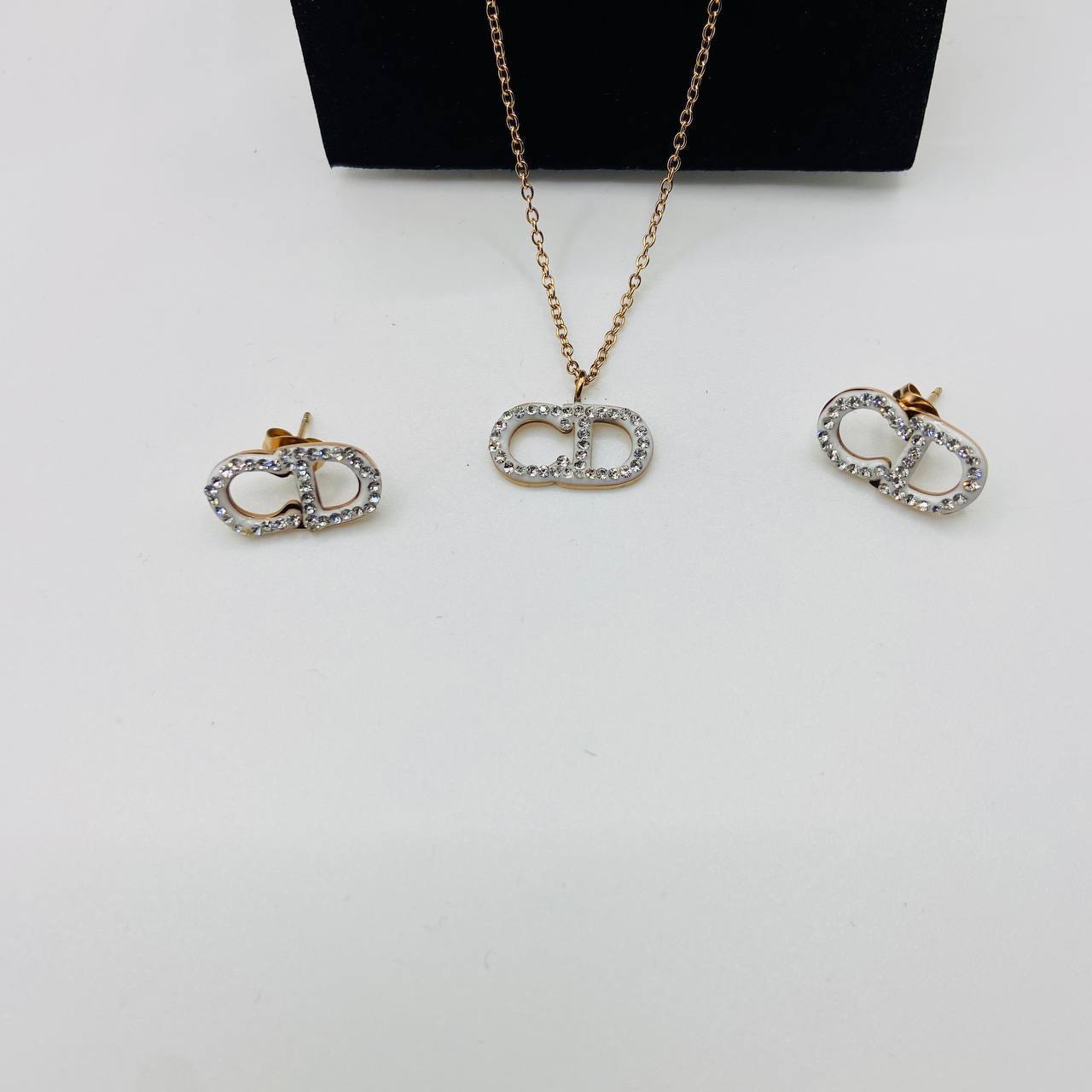 CD DIO earings and necklace set with packaging to0105