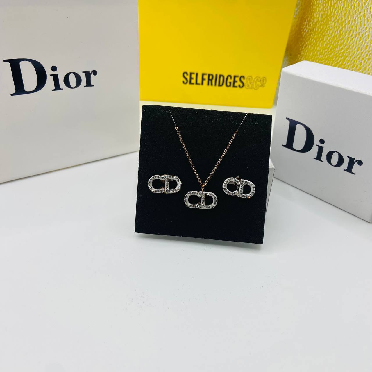 CD DIO earings and necklace set with packaging to0105